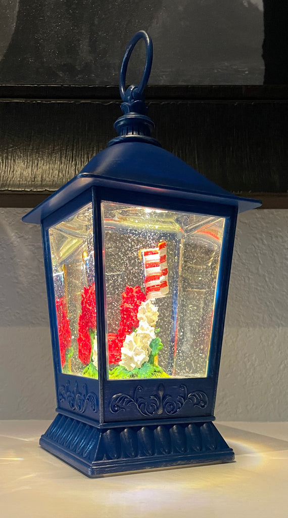 Patriotic Water Lantern with American Flag, 11.5 Inch, LED Light, Swirling Glitter Snow Globe Design, Battery/USB Powered, Blue, Red and White Geranium Flowers