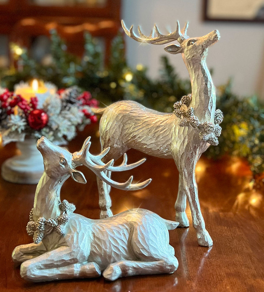 TenWaterloo Silver Sparkled Christmas Reindeer Figurine Set of 2, Sculpted Resin Deer Statues, 12 Inches High, with Pinecone Garland Accents